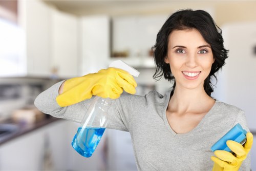 Technician wearing PPE while preparing carpet cleaning equipment